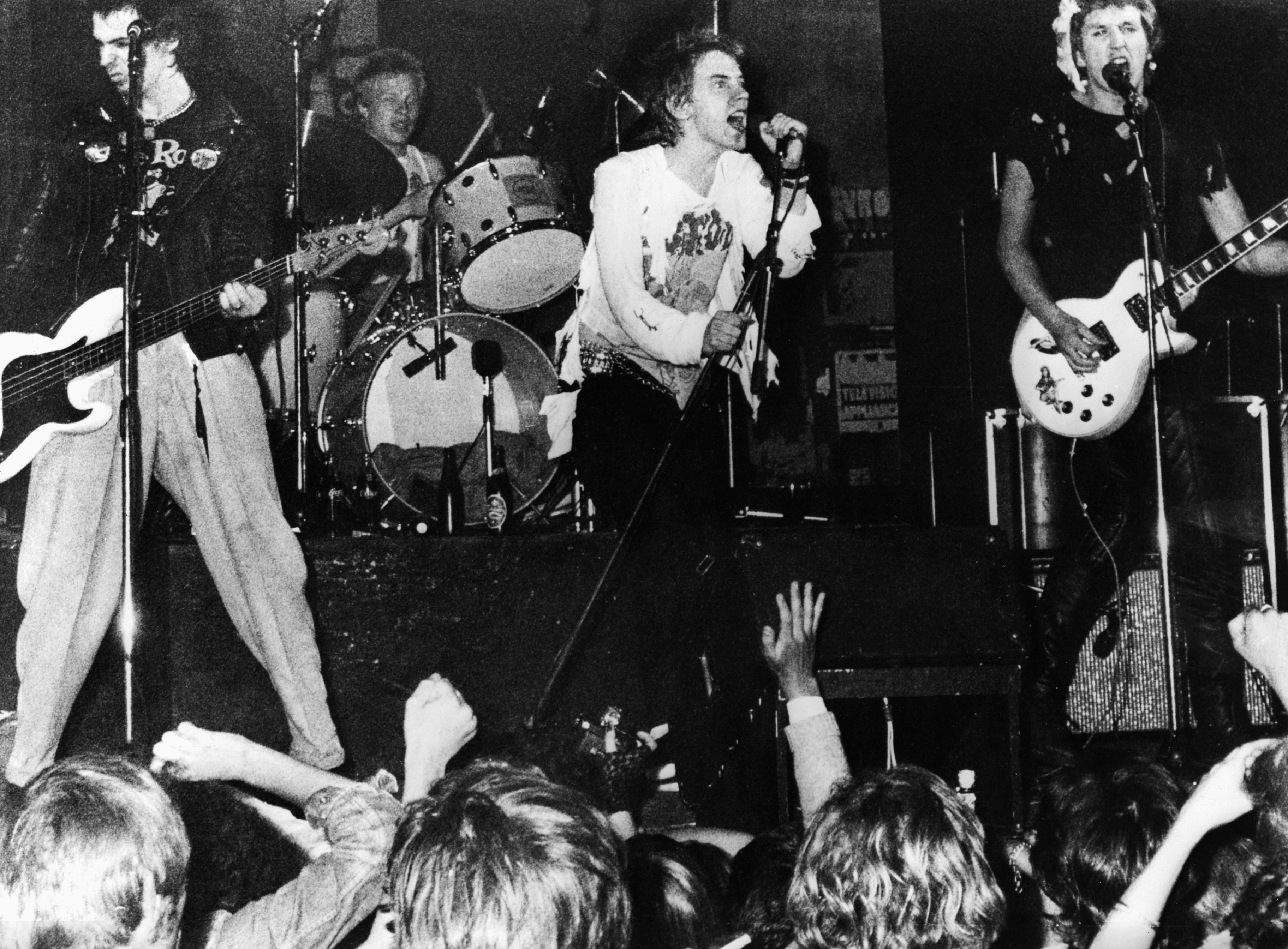 Johnny Rotten sings for The Sex Pistols, a widely known punk band, circa 1975. (Photo by &amp;copy; Hulton-Deutsch Collection/CORBIS/Corbis via Getty Images)