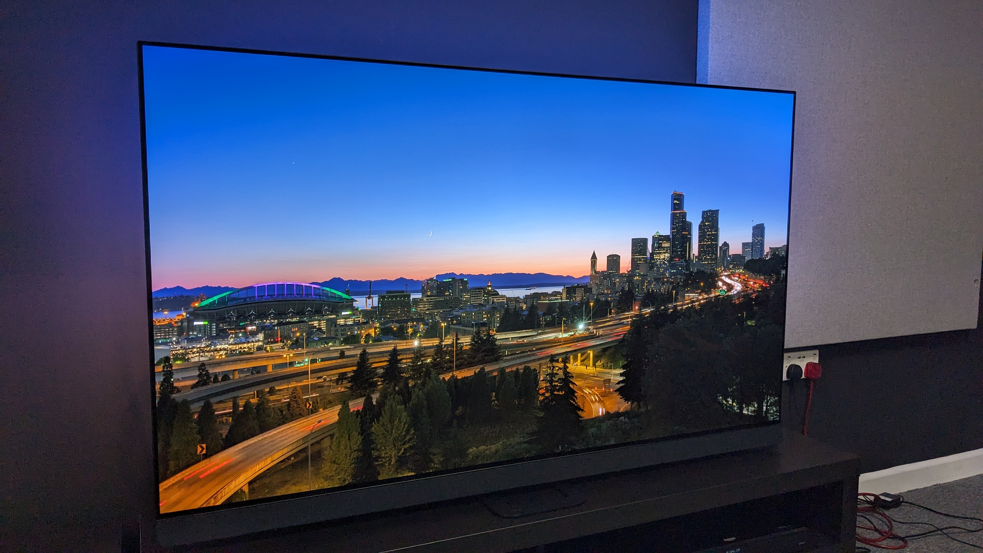 Philips OLED908 with city landscape on screen