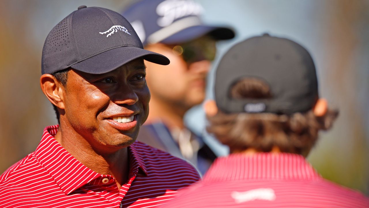 Tiger Woods and Charlie Woods celebrate the hole in one at the PNC Championship