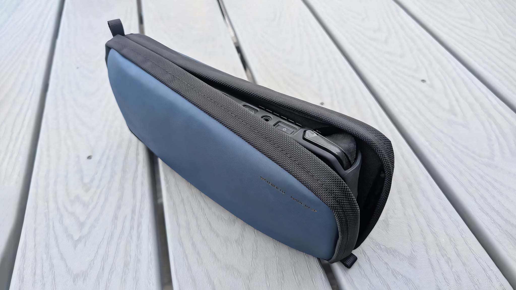 The Waterfield ROG Ally X Magnetic Case standing upright on a grey table with the magnetic seal cracked open to view the Ally X inside.