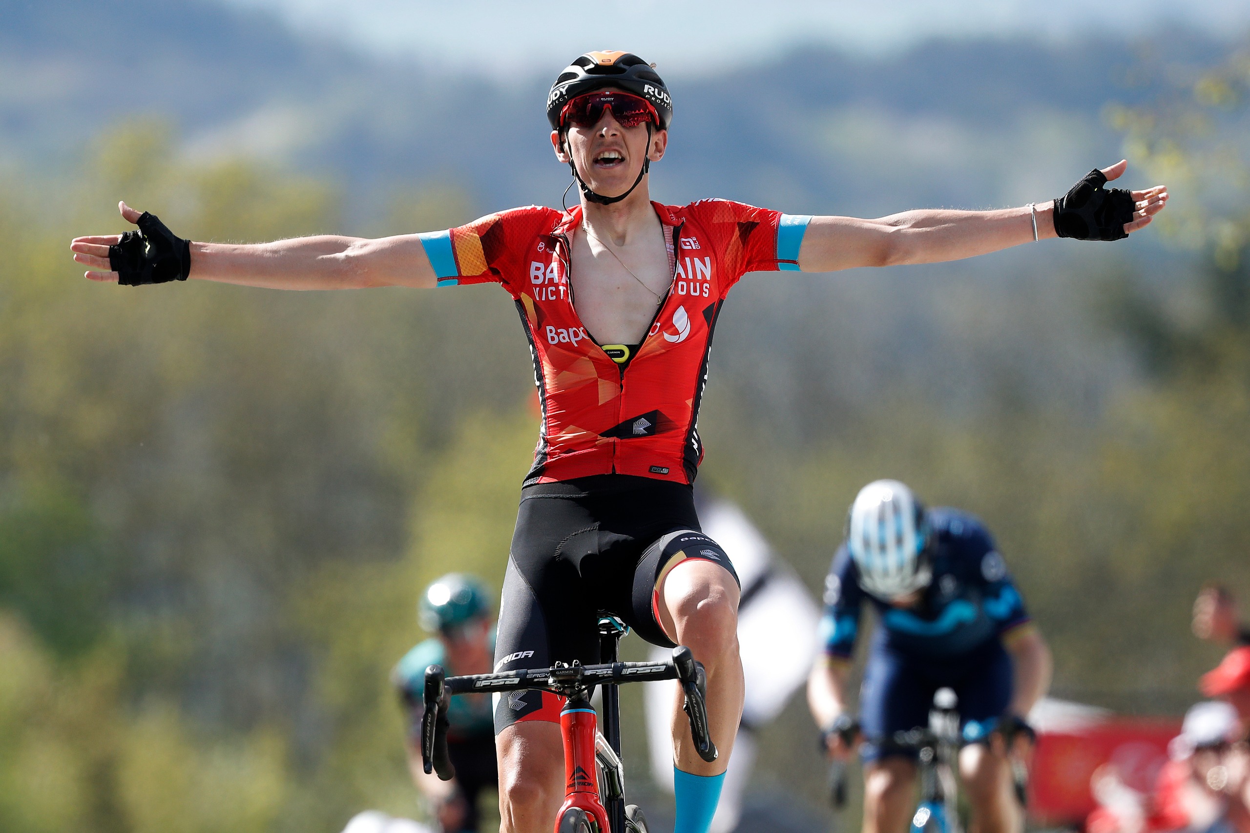 Dylan Teuns celebrating with his arms outstretch after winning La Fl&amp;egrave;che Wallonne