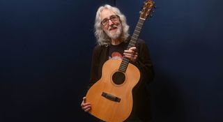 Gordon Giltrap is photographed with his Fylde acoustic – a guitar built in the '70s for his hero, the folk legend Bert Jansch.