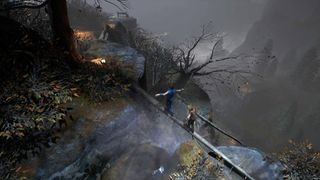 Brothers A Tale of Two Sons Remake; two children balance on a log above a waterfall