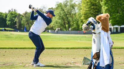Rory McIlroy hits a driver shot on the range