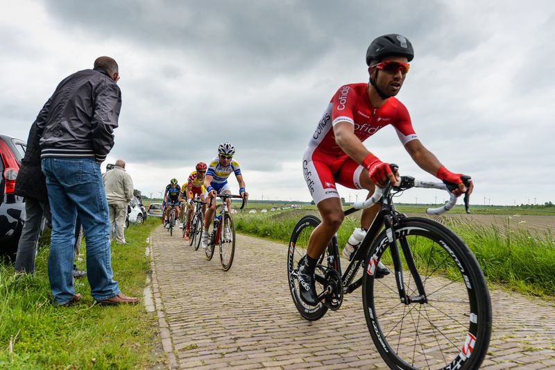 Nacer Bouhanni riding over a section of pave