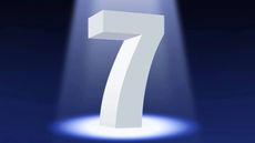 A white number seven in 3D standing on a dark background illuminated by a spotlight