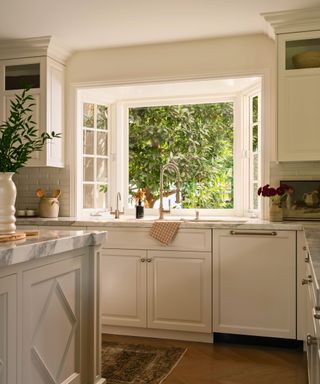 kitchen with cream cabinets and open windows