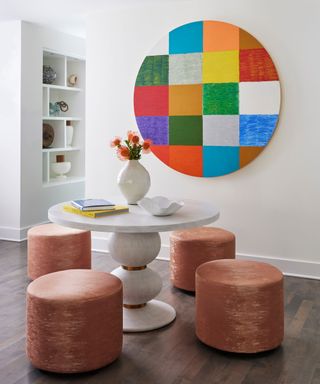 Living room with two chairs and circular art