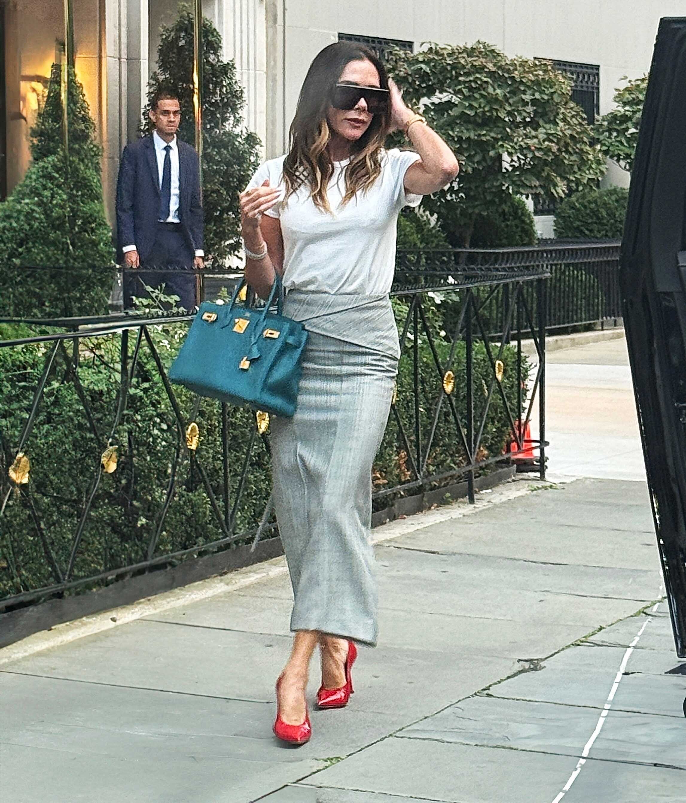 Victoria Beckham was spotted in an unexpected color combo: red and a teal Herm&amp;egrave;s Birkin bag