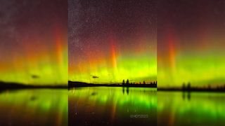 Multicolor auroras shining in the sky above a lake