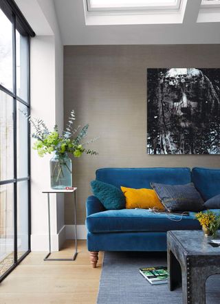 A living room with a big artwork