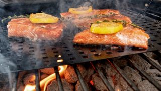 a piece of salmon with herb marinade grilling on a bbq can you grill salmon