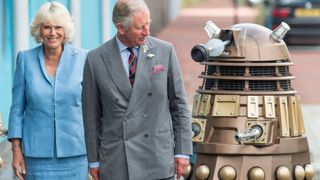 Charles and Camilla with a dalek.