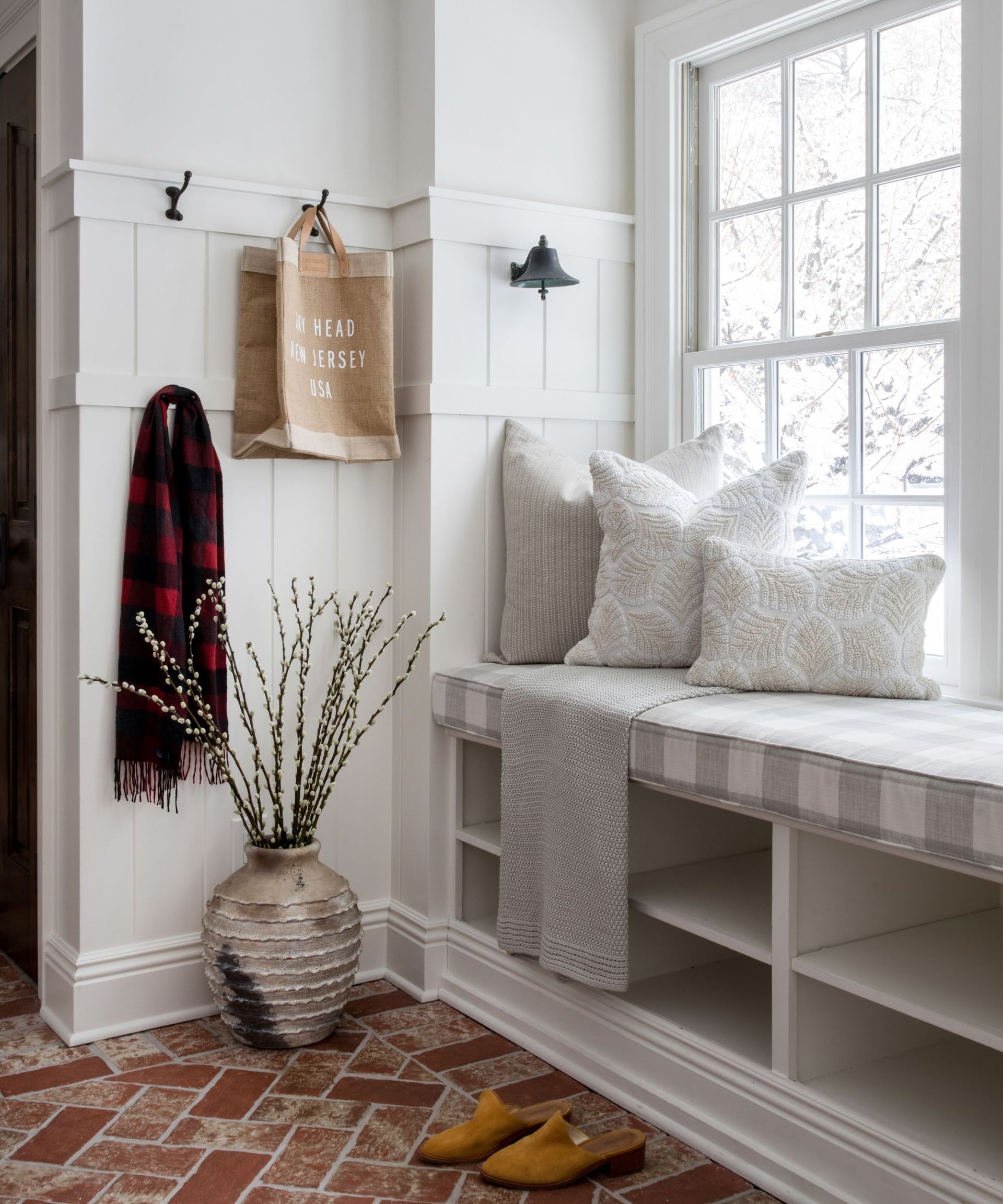 Entryway with storage beneath window