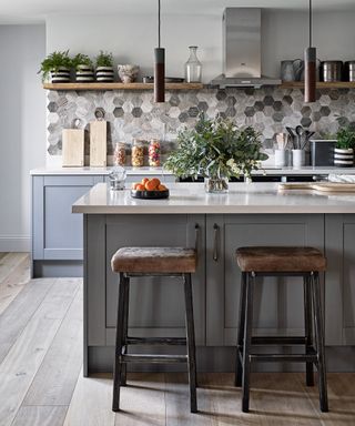 Galley kitchens example in gray with hexagonal tiled backsplash.