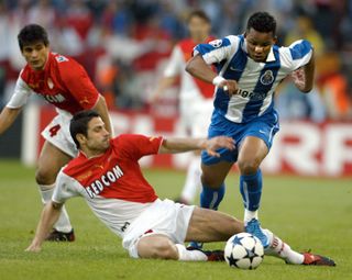 Andreas Zikos of Monaco, left, challenges Carlos Alberto of Porto during the UEFA Champions League Final between AS Monaco and FC Porto in the 'Arena AufSchalke' in Gelsenkirchen, Germany, Wednesday, May 26, 2004. (AP Photo/Frank Augstein) - Image ID: 2PEYAM4 (RM)