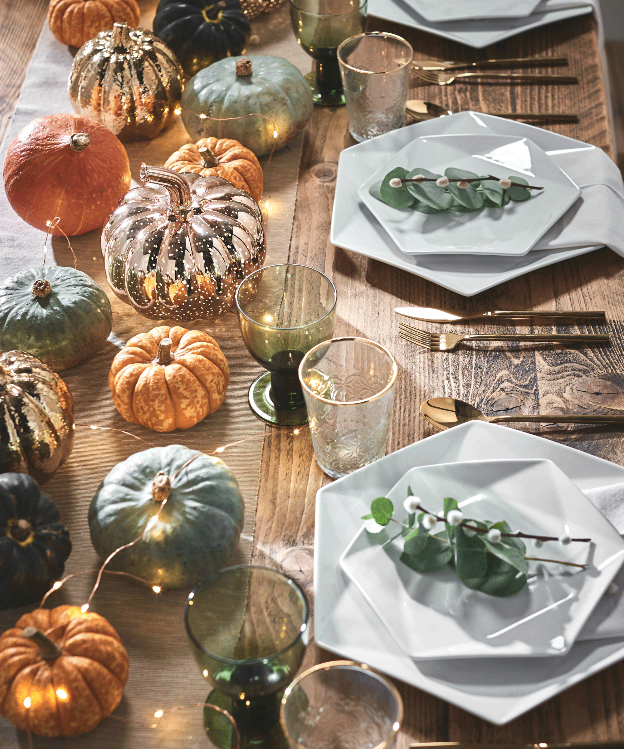 pumpkins on a laid dining table