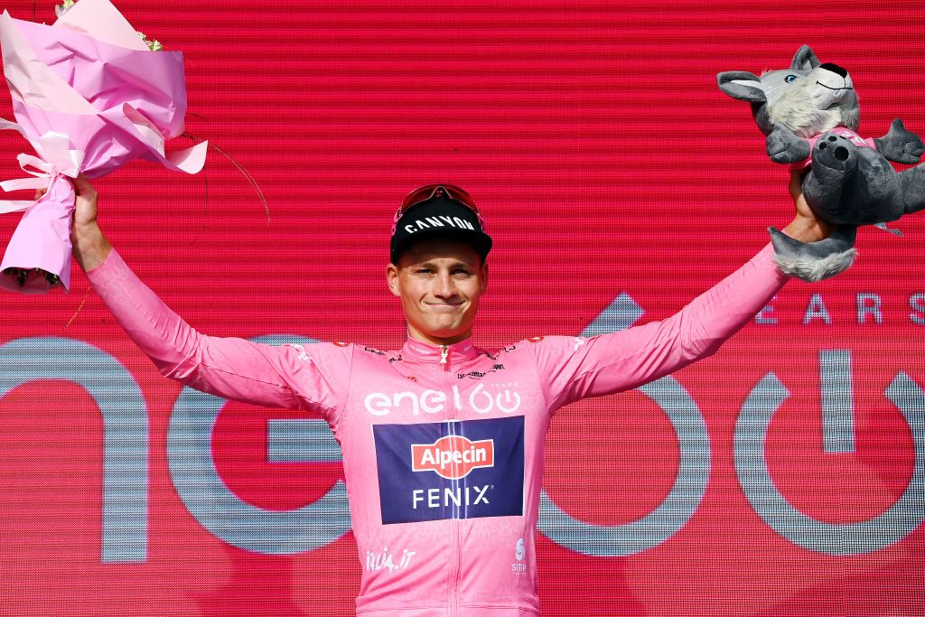 BUDAPEST HUNGARY MAY 07 Mathieu Van Der Poel of Netherlands and Team Alpecin Fenix celebrates winning the pink leader jersey on the podium ceremony after the 105th Giro dItalia 2022 Stage 2 a 92km individual time trial stage from Budapest to Budapest ITT Giro WorldTour on May 07 2022 in Budapest Hungary Photo by Tim de WaeleGetty Images