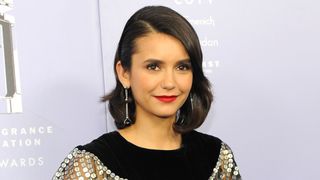 nina dobrev on the red carpet with a bob hairstyle