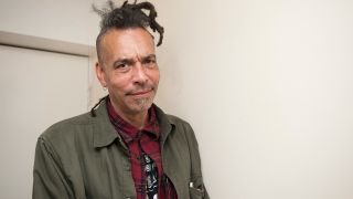 A portrait of Chuck Mosley looking into the camera