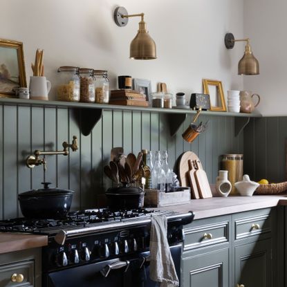 green kitchen with wood panelling