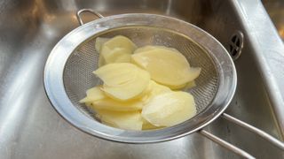 Drain potato slices