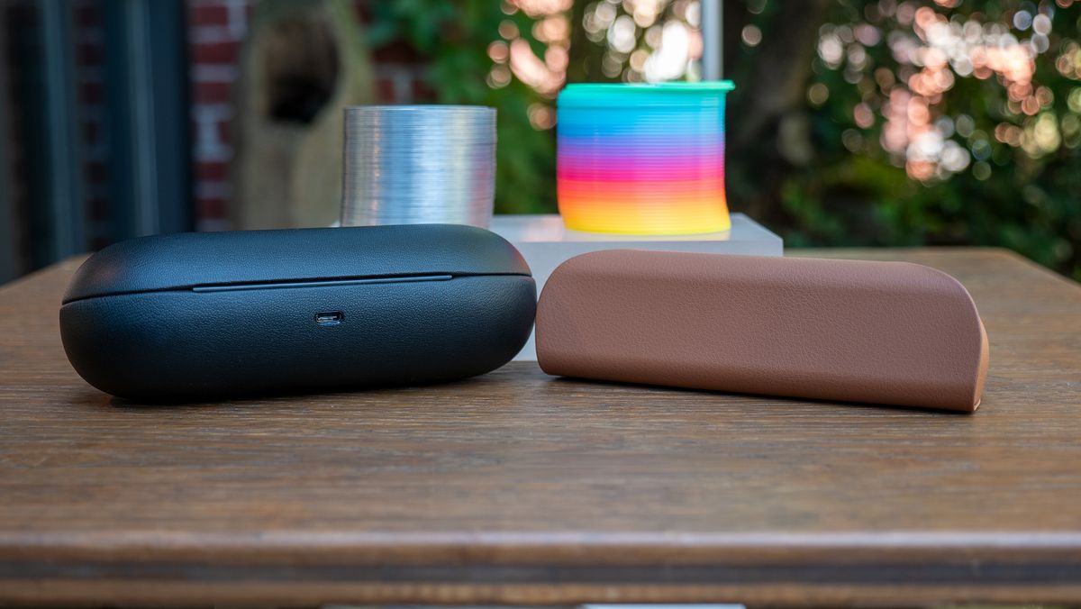 Comparing Ray-Ban Meta smart glasses in the new tan charging case with Ray-Ban Stories in its larger black charging case