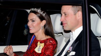 The Prince and Princess of Wales in a car on their way to a reception for members of the Diplomatic Corps