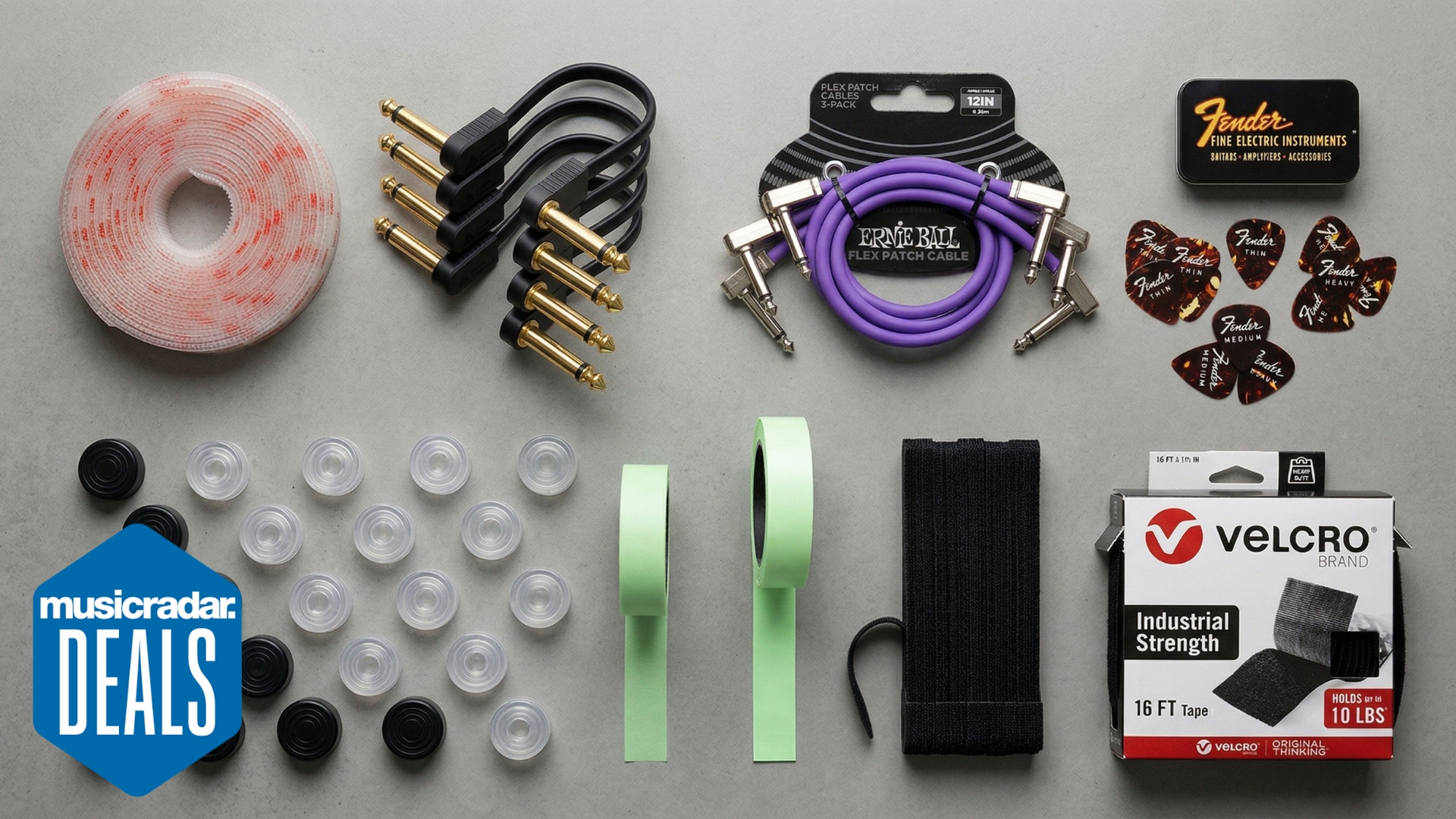 A selection of pedalboard accessories on a grey background