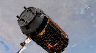 The Japan Aerospace Exploration Agency's HTV-8 cargo ship is captured by a robotic arm at the International Space Station on Sept. 28, 2019 to deliver more than 4 tons of supplies to the orbiting laboratory. 