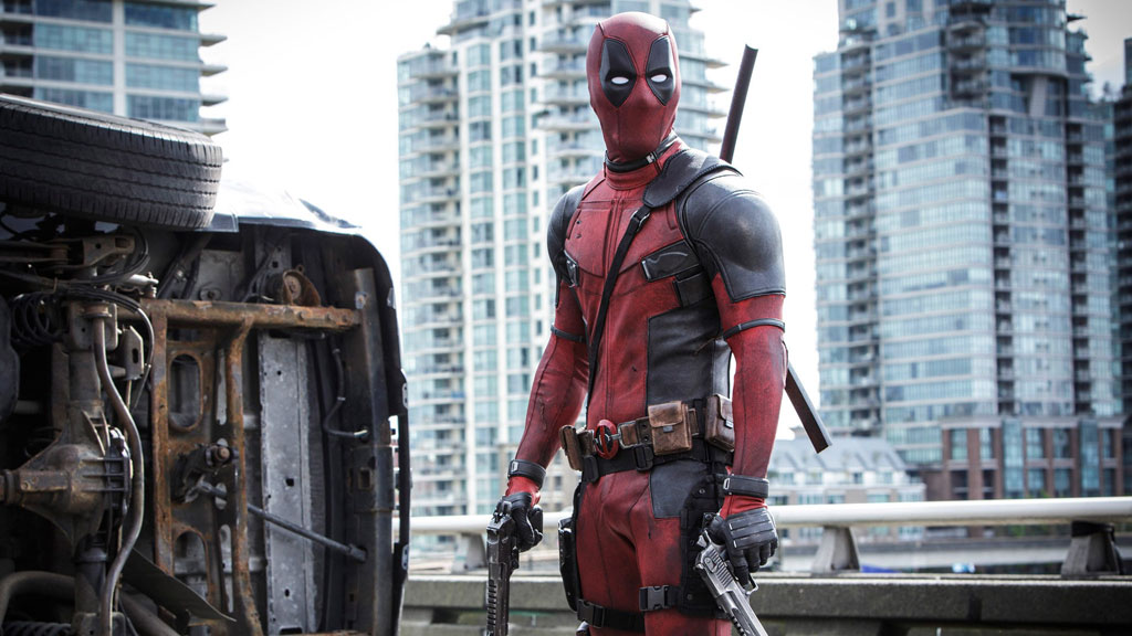 Ryan Reynolds' Deadpool looks at someone off-camera in his 2016 self-titled film