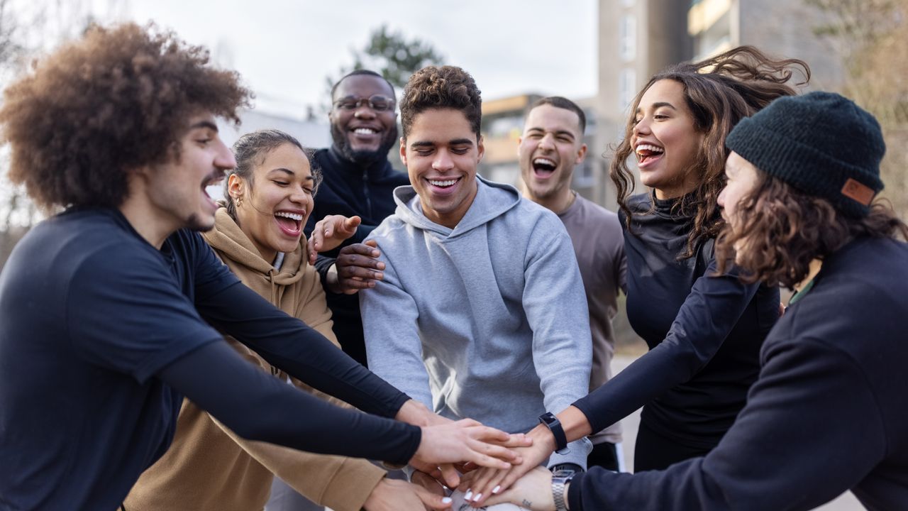 Group exercising outside for happiness