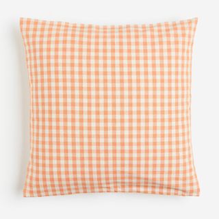 Orange gingham throw pillow