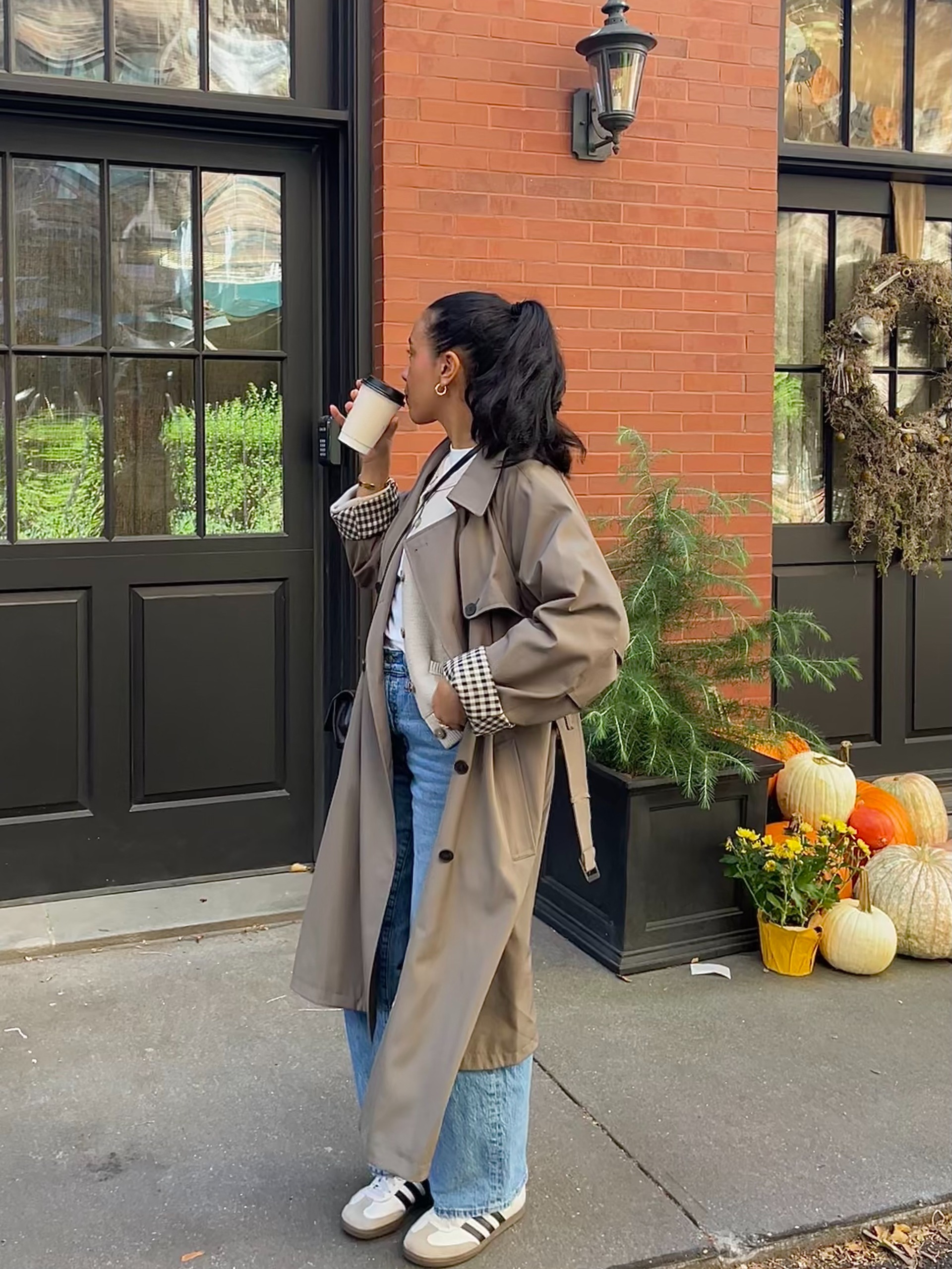 Lauren Tappan wearing an olive green trench coat