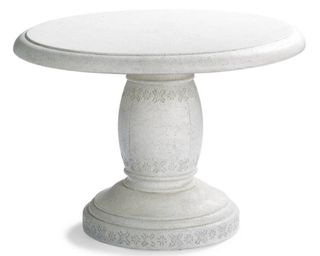 A faux stone composite round outdoor patio bistro table