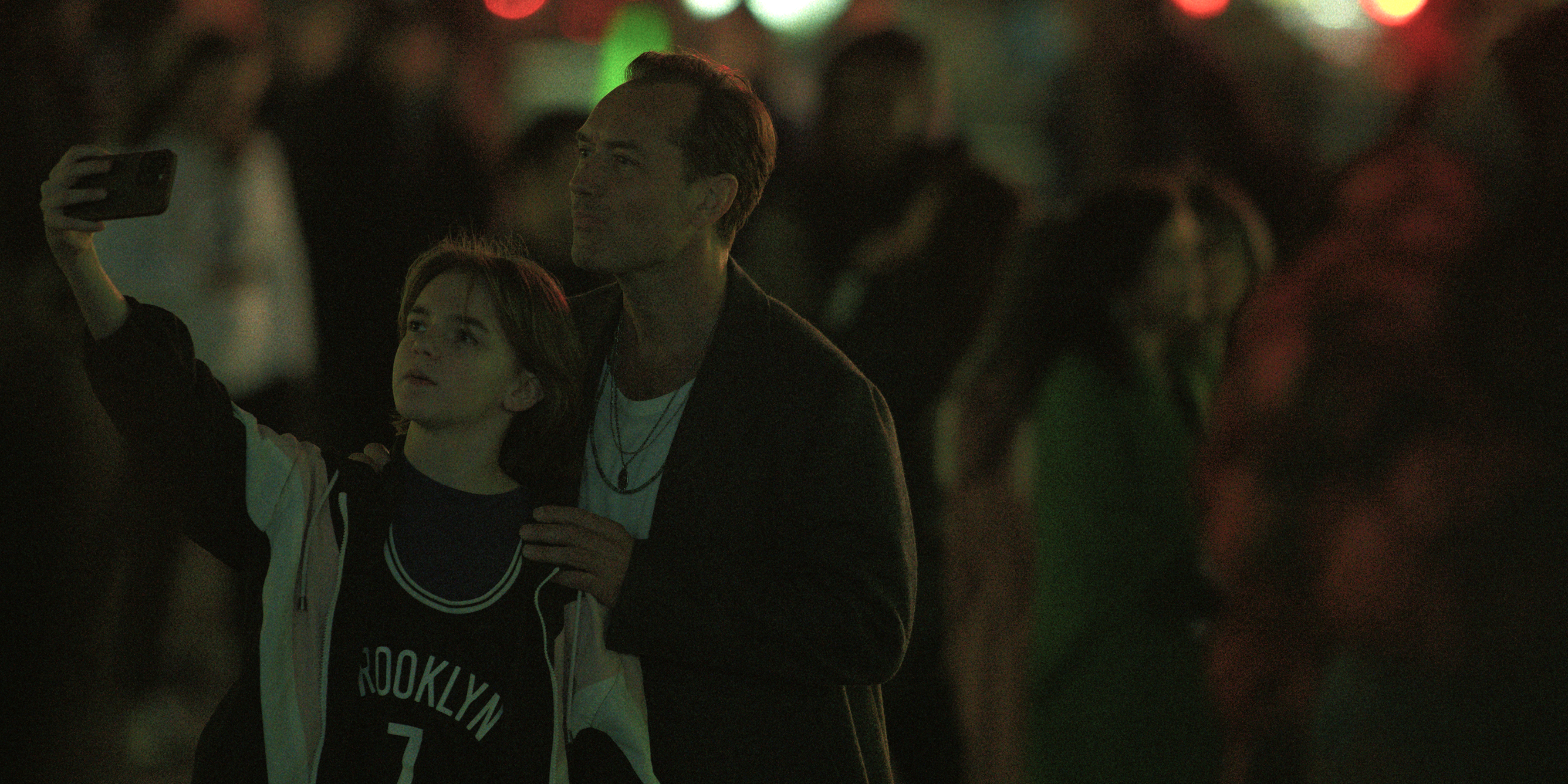 michael cash as hunter and jude law as jake taking a selfie in an nyc street in black rabbit