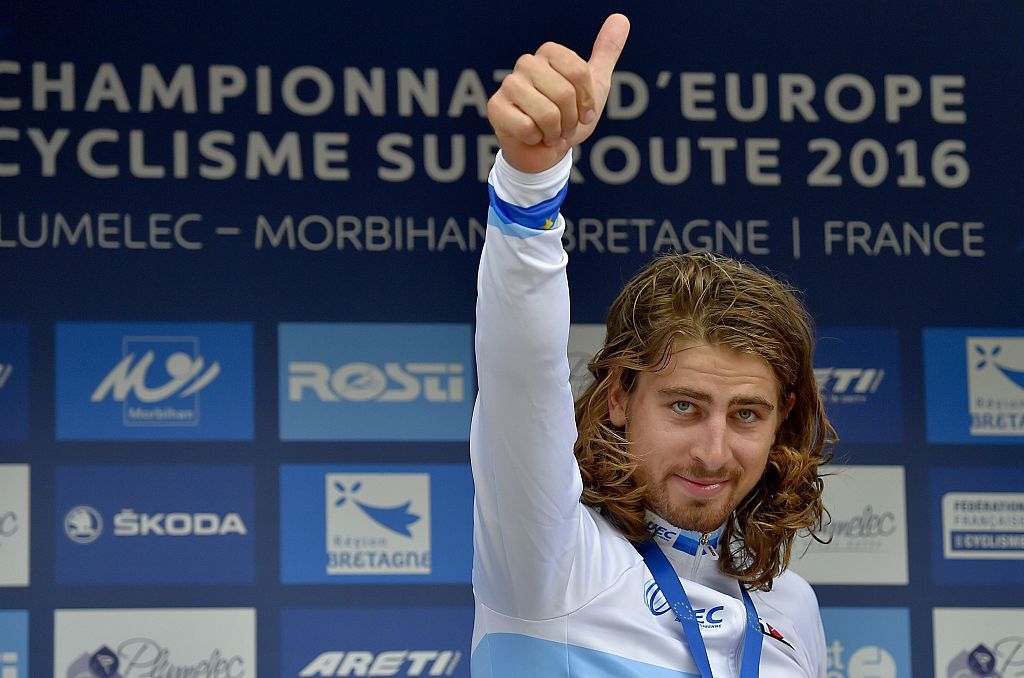 Slovakias Peter Sagan celebrates on the podium after winning the Mens Elite Race of the 2016 UEC Road European Championship on September 18 2016 in Plumelec western France