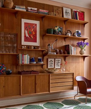 midcentury modern shelving system filled with unique artwork books and decor