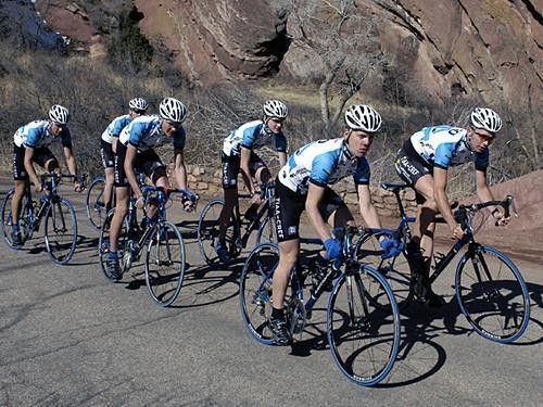 The team climbing out of the saddle.
