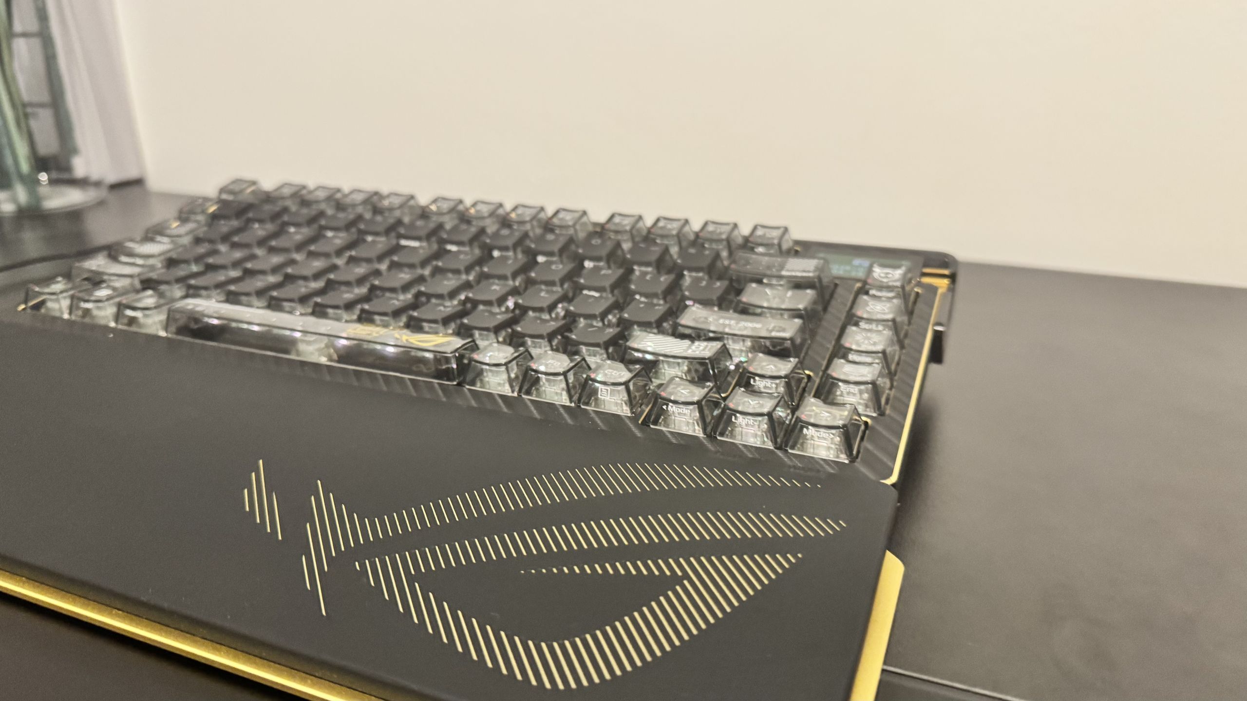Asus ROG Azoth Extreme Edition 20 from the front, to the side, on a black desk