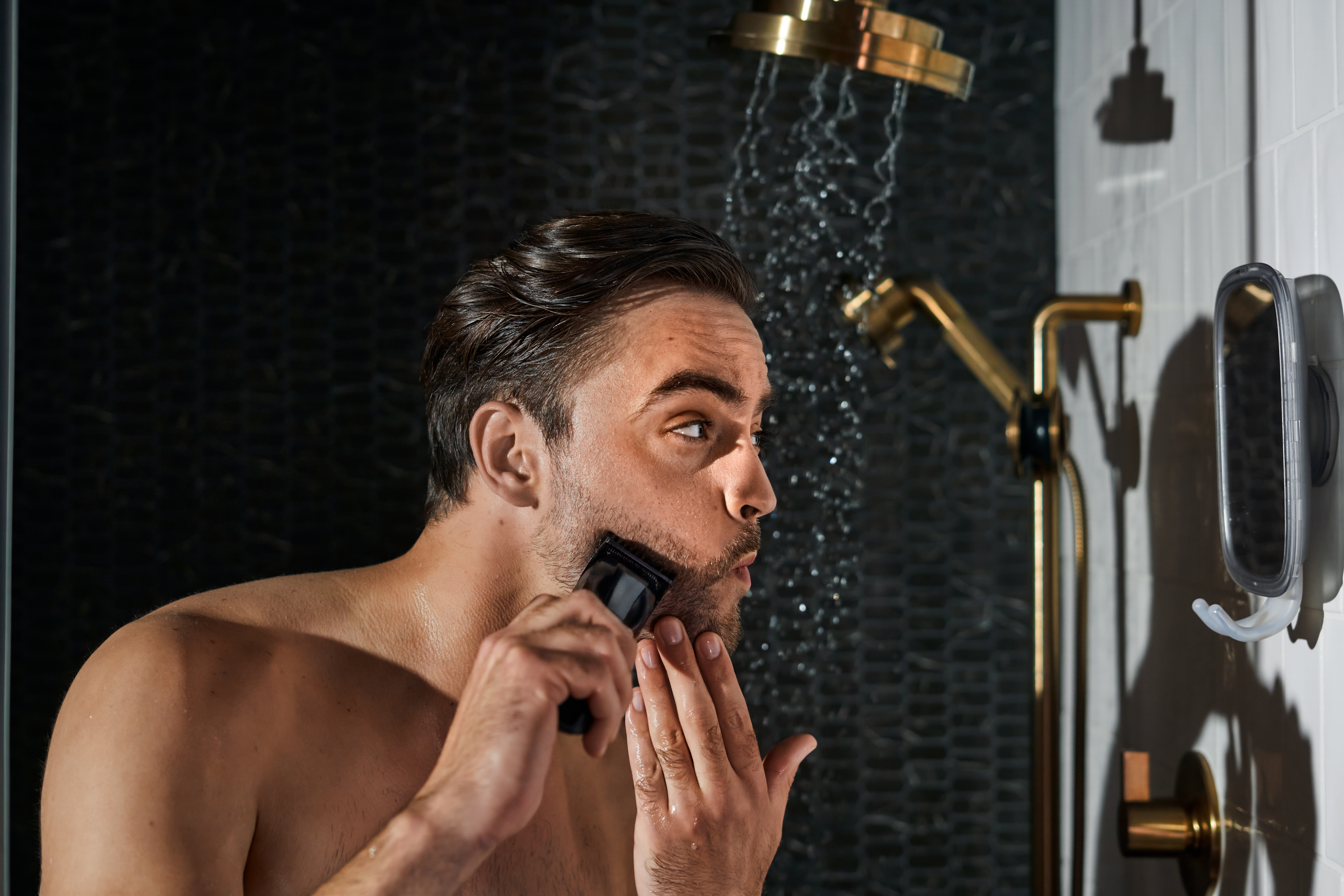 an image of a man shaving a beard in a mirror