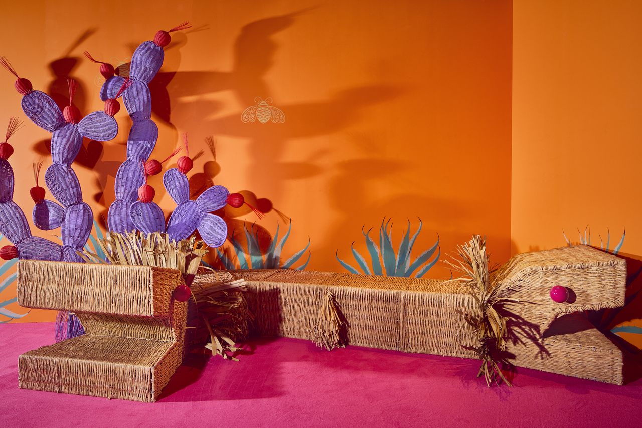 Installation view of &iexcl;hola, London!, a whimsical art installation made of whicker-made furniture molded after dragons, cacti, and fantastical creatures, at sketch London.