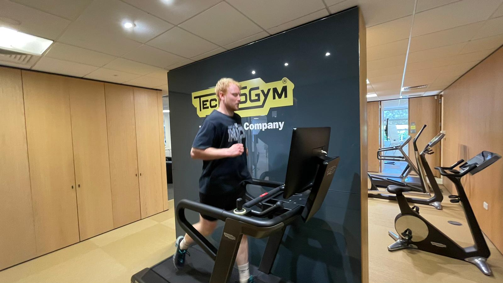 TechRadar fitness writer Harry Bullmore testing the Technogym Run treadmill