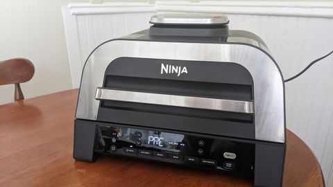 Ninja Foodie Smart XL 6-in-1 Indoor Grill & Air Fryer with Built-In Thermometer, 2nd Generation on dining table