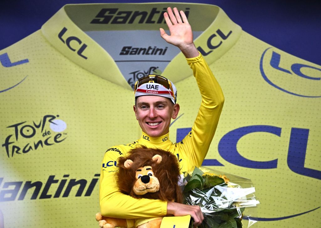 UAE Team Emirates teams Slovenian rider Tadej Pogacar celebrates on the podium after the 6th stage of the 109th edition of the Tour de France cycling race 2199 km between Binche in Belgium and Longwy in northern France on July 7 2022 Photo by AnneChristine POUJOULAT AFP Photo by ANNECHRISTINE POUJOULATAFP via Getty Images
