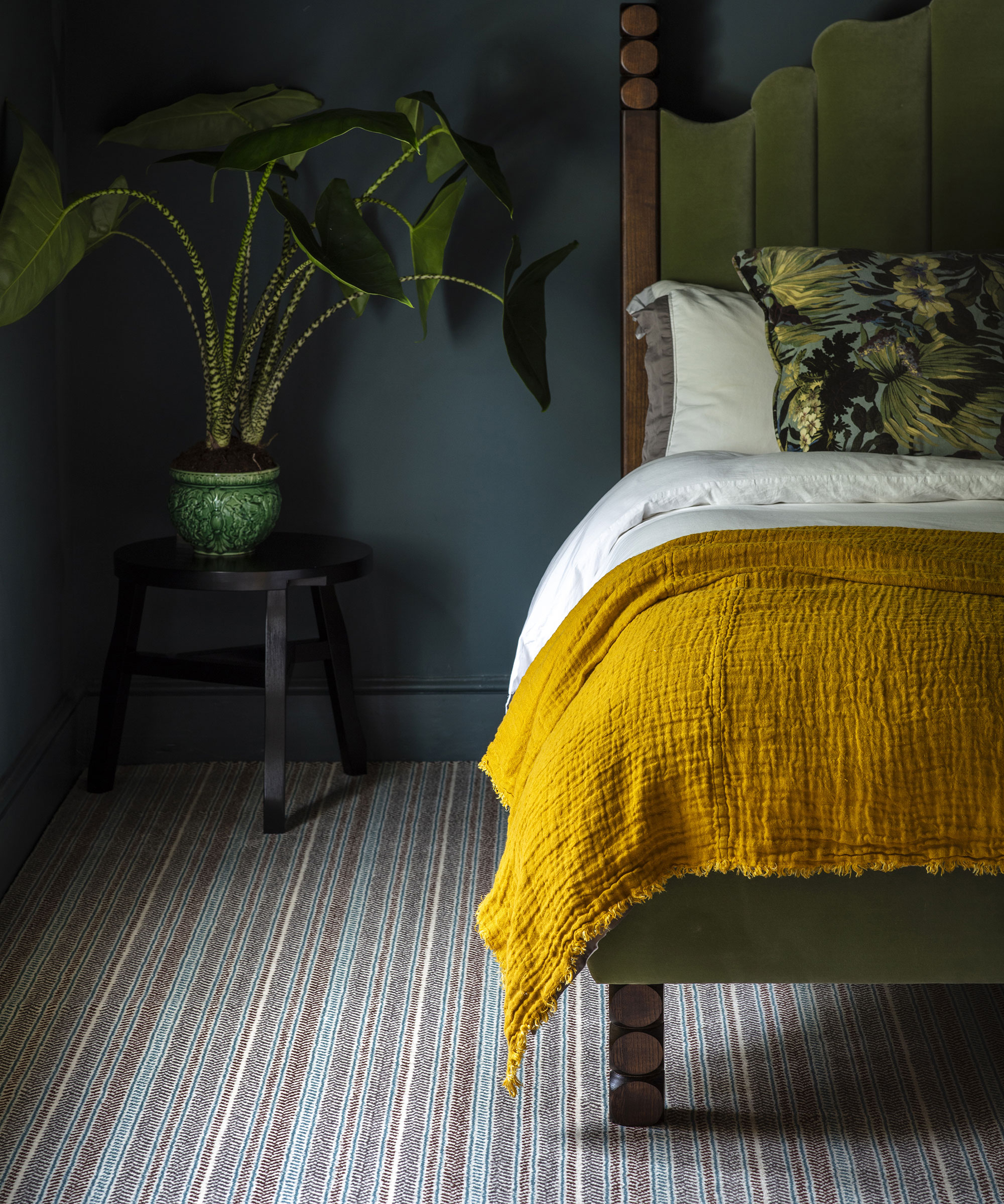 grey bedroom with striped carpet