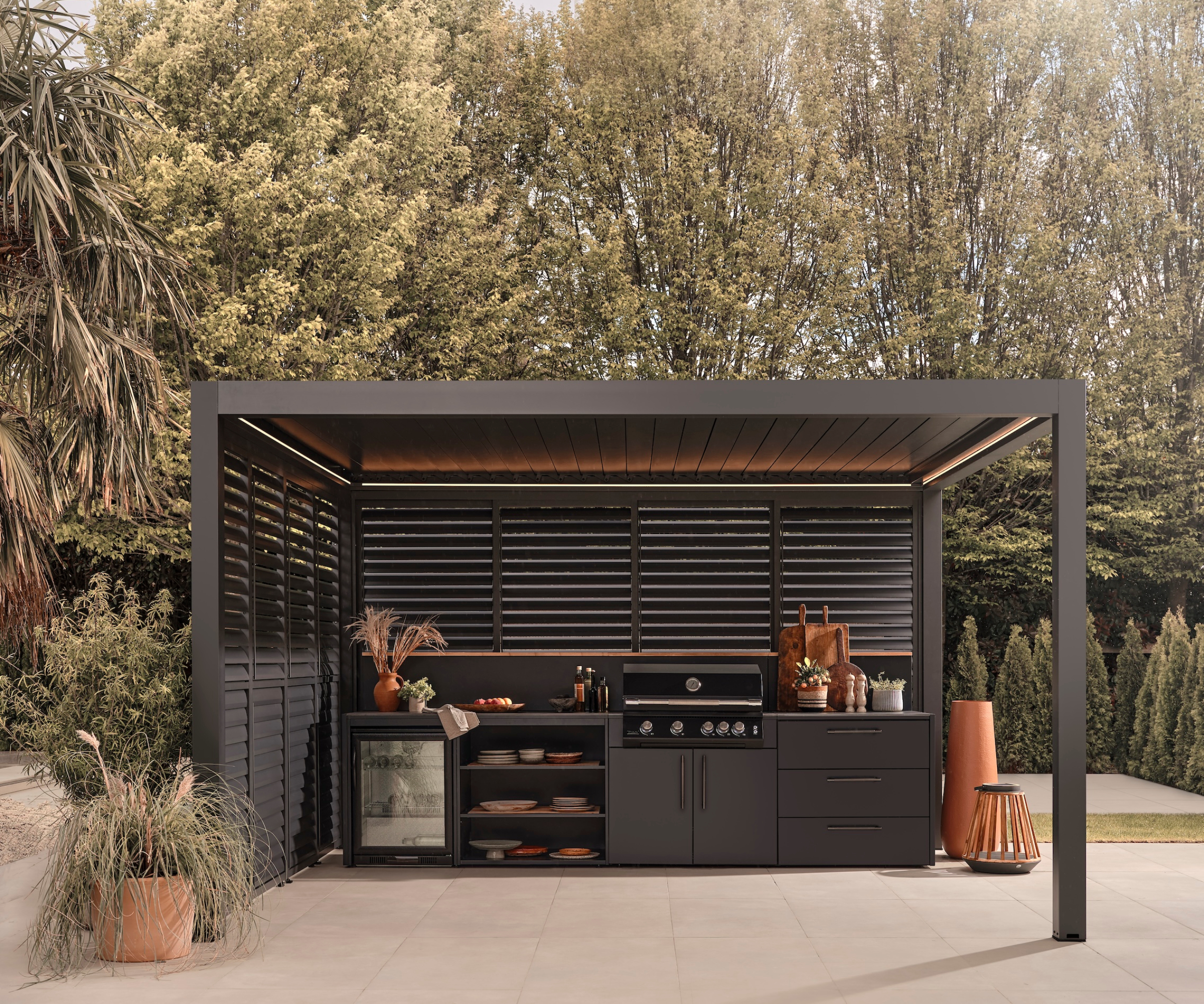 grey aluminium large pergola over seating and outdoor kitchen