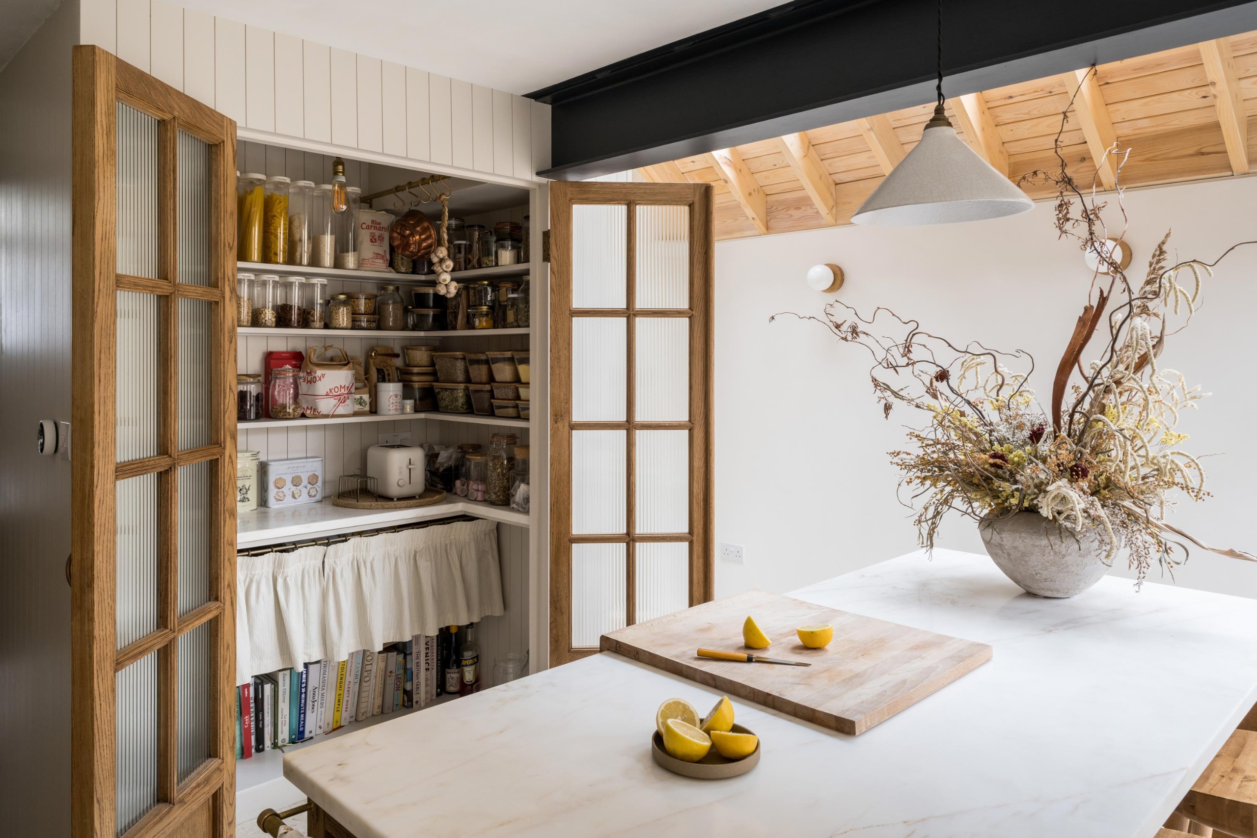 a small pantry with double doors 