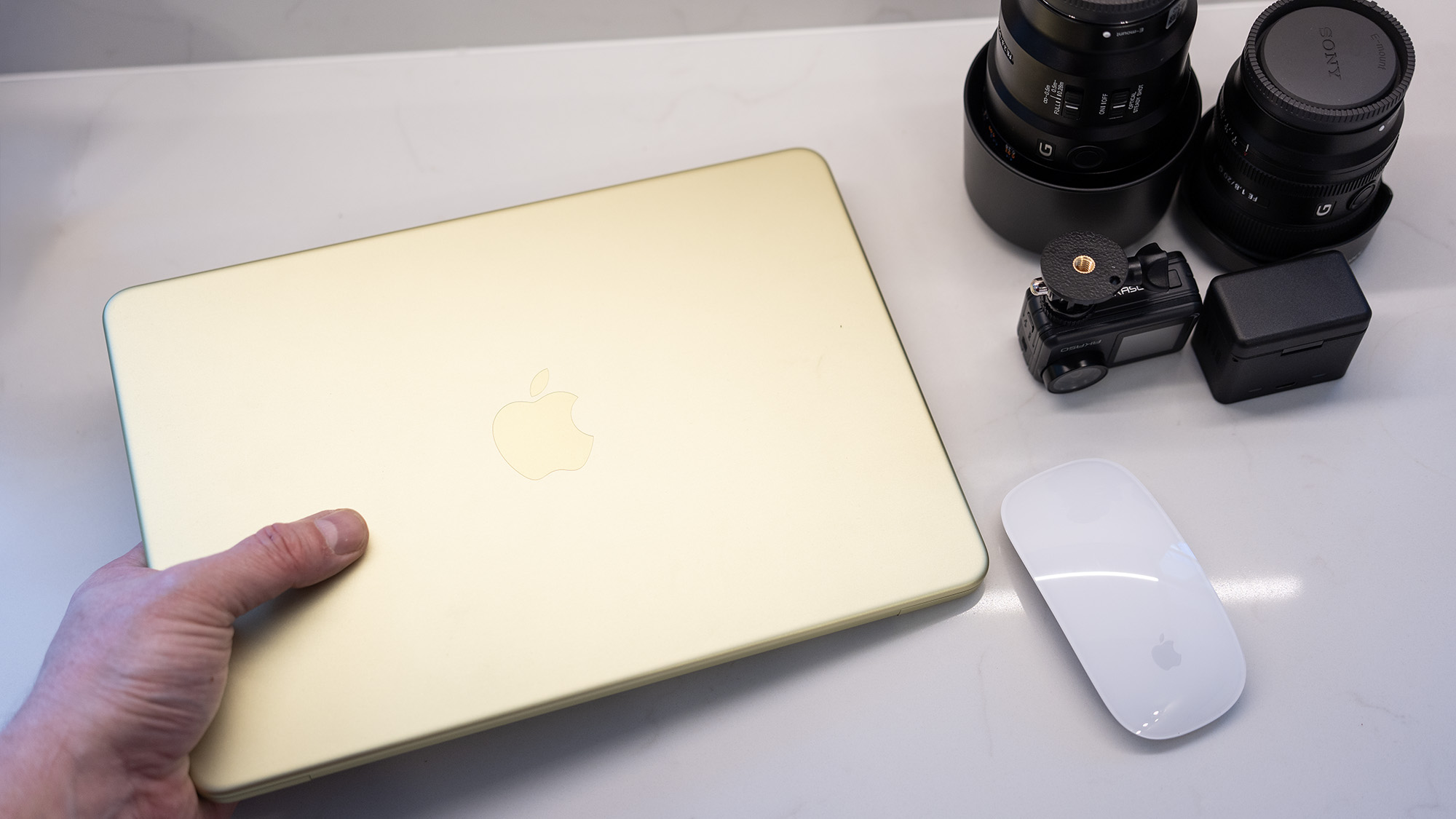 Apple MacBook Neo laptop in yellow on a desk