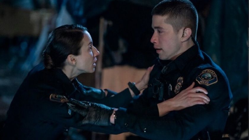 Long Beach police officer Traci Harmon (Troian Bellisario) comforts shaken rookie cop Alex Diaz (Brandon Larracuente) during a perilous call out in new Prime Video series &quot;On Call&quot;